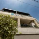 Εξωτερική όψη του συγκροτήματος Lagoon Isle Luxury Suites με πέτρινη πρόσοψη